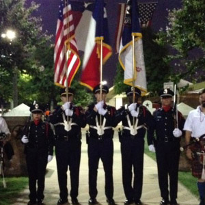 Sgt. Lovel, holding the American flag, leads Webster’s honor guard.